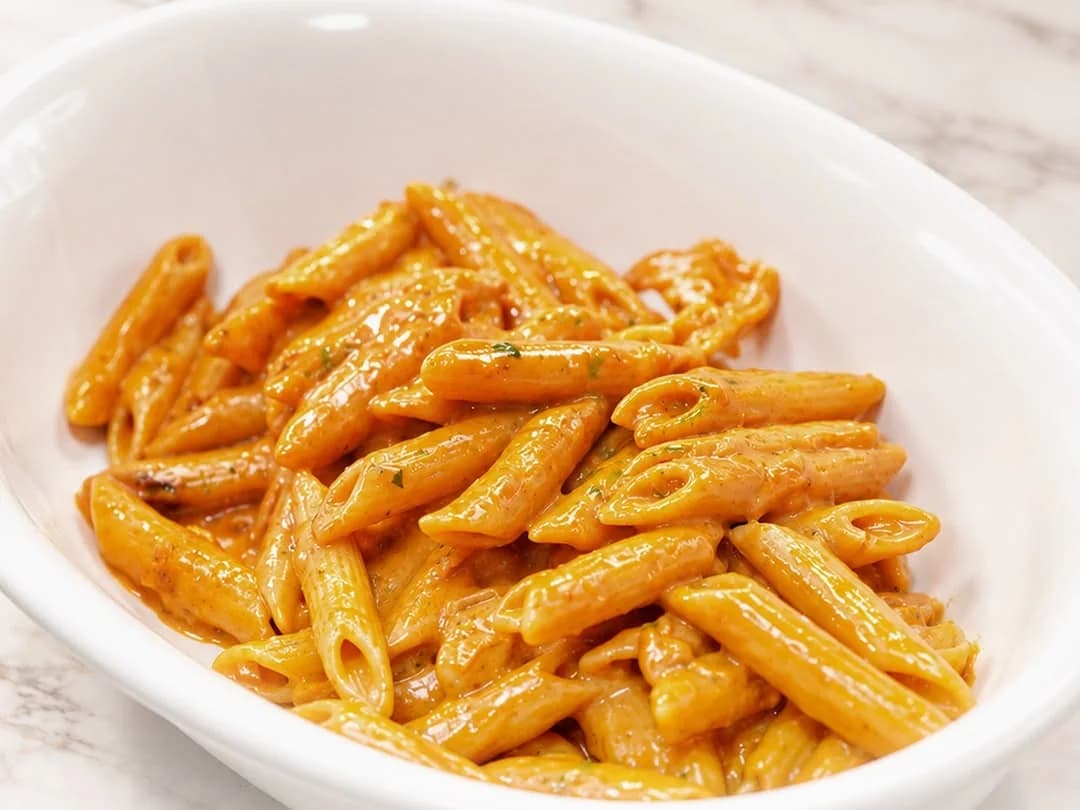 Penne in a creamy tomato sauce